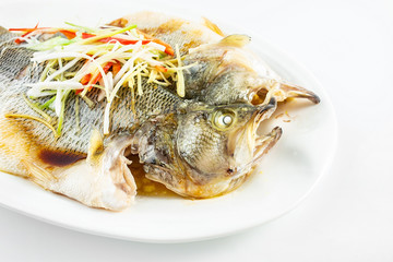 Chinese Cantonese cuisine dish with steamed squid on white background