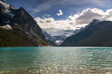 View of Lake Louise with turquoise water colour  in summer with Colud Sky, Banff National Park, Alberta, Canada