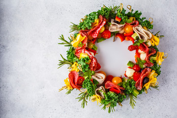 Christmas food background. Christmas wreath of holiday snacks, white background.