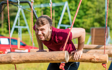 Extreme obstacles overcome by runner in the boot camp