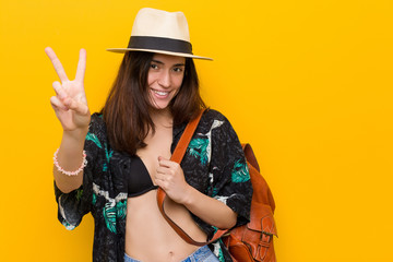 Young caucasian woman wearing a bikini and hat