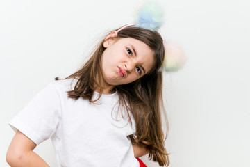 Naklejka premium Little caucasian girl with costume and accessories having fun