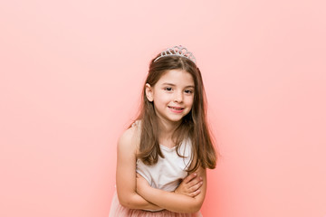 Little girl wearing a princess look laughing and having fun. © Asier