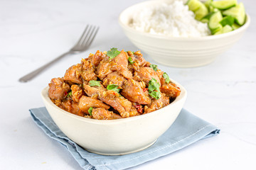 Stir Fried Chicken in a White Bowl on White Background. Chinese Style Cooked Chicken.