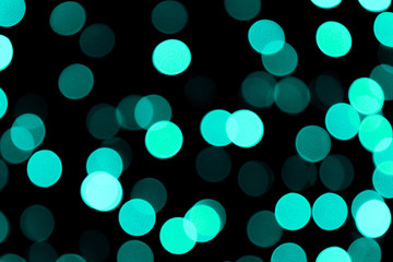 Unfocused abstract colourful bokeh black background. defocused and blurred many round blue light