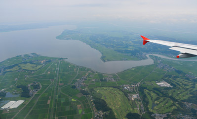 Flying over rural scenery in summer day