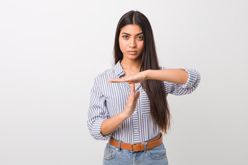 Young pretty arab woman showing a timeout gesture.