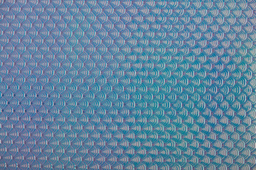 Iridescent holographic mermaid scales faux leather texture background.