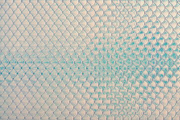 Holographic mermaid fish scales iridescent faux leather texture background.