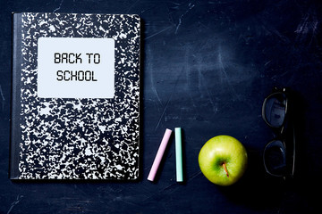 Back to school or student and education concept. Top view. Flat lay. School notebook, crayons and apples.