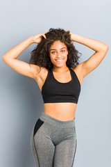 Young african american sporty woman posing