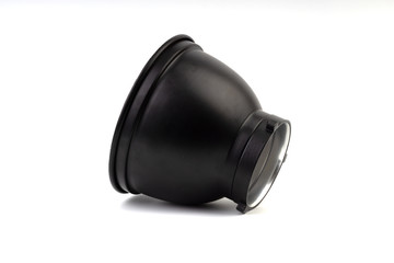 Reflector with honeycomb grid accessory for studio strobes and flashes on white background. Selective focus