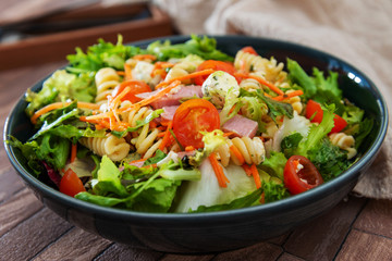 Salad made from radiatori cooked pasta, goat cheese and oil vinaigrette