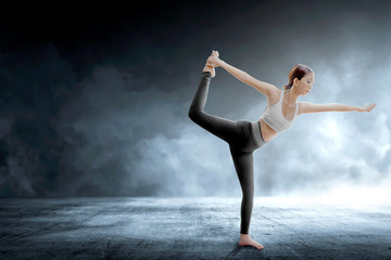 Fototapeta na wymiar Asian healthy woman practicing yoga on indoor