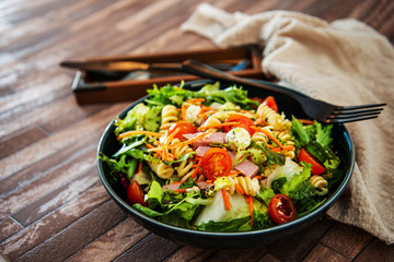 Salad made from radiatori cooked pasta, goat cheese and oil vinaigrette