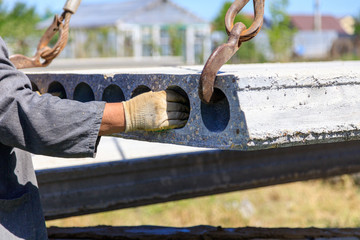 Installing concrete slabs at a construction site at home
