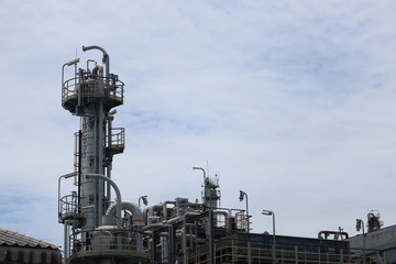 oil refinery at sunset