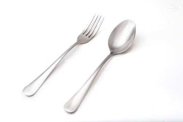 metal spoon and folk on white background