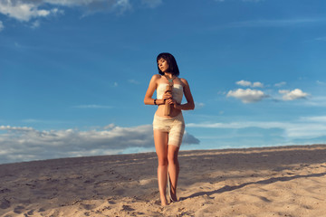Young girl in the desert dressed in Egyptian style