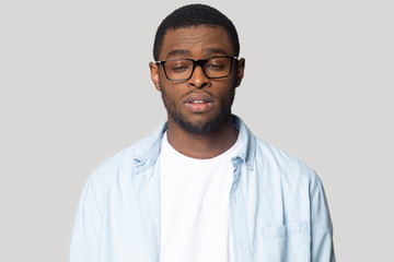 Tired black male in glasses feel sleepy or exhausted