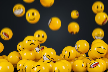 Falling emoji characters with motion blur on the black background.