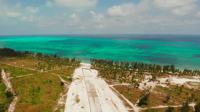 Construction of the runway of the local airport on a tropical island. Construction of a landing strip. Balabac, Palawan, Philippines.