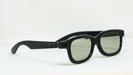 The side view of black glasses is placed on a white background.