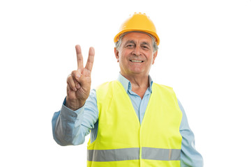 Builder showing victory or peace sign