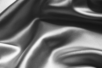 Fototapeta na wymiar Silver wavy silk background texture