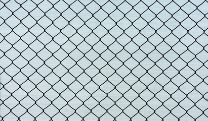 silhouette cage metal wire front fabric background
