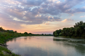 Fototapeta na wymiar colorful summer sunset over the river