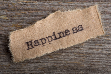 Happiness -word typed on a piece of paper, motivation concept to move on to find your personal blessing