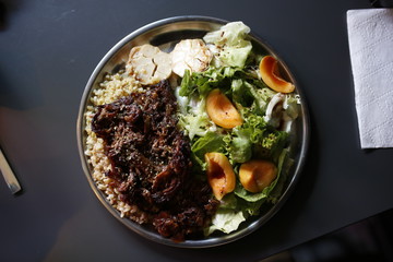 Meat and rice with vegetables.