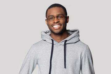 Smiling black male in hoodie posing for picture - Powered by Adobe