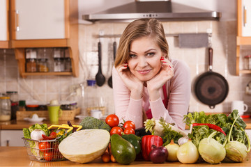 Obraz na płótnie Canvas Woman having vegetables on table