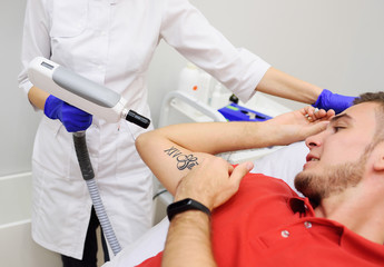 tattoo removal neodymium laser in the beauty salon . Laser cosmetology