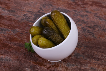 Pickled cucumbers heap in the bowl