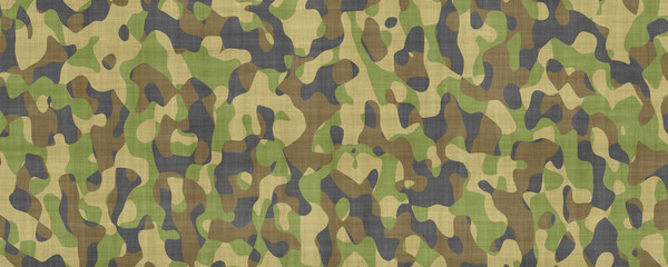 Fototapeta premium Military camouflage pattern fabric texture, green and brown woodland camo background, tactical army uniform textile material for hunting and outdoor gear