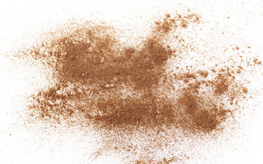 Cinnamon powder isolated on white background, top view