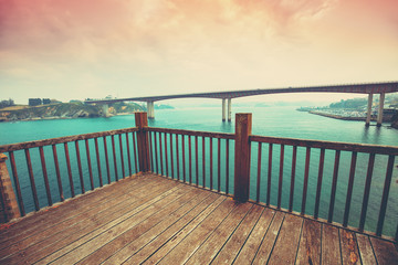 Fototapeta premium View of the Ponte dos Santos bridge from the wooden pier on the O Cargadeiro, Ribadeo, Spain