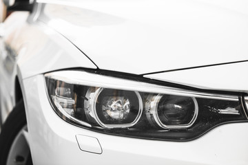 Stylish headlight of white car