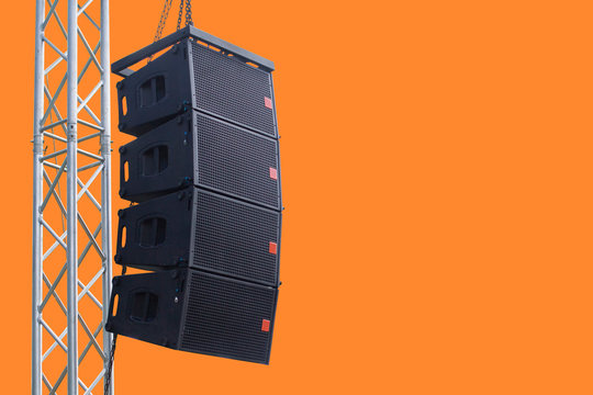 Black speaker hanging on a stand / Sound System in concert. Clipping path.