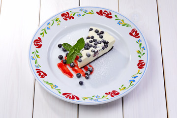 cheesecake with fresh blueberries and mint