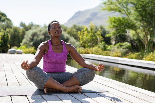 Mature black woman in lotus position