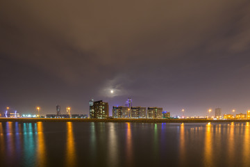 Fototapeta na wymiar Bahrain skyline at night with beautiful reflections and striking illuminations