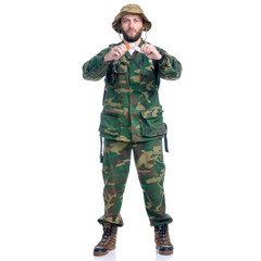 Man in camouflage clothes with backpack and knife hiking standing looking on white background isolation