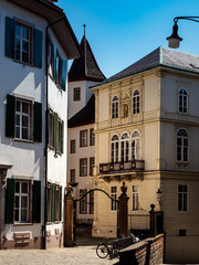 Calm narrow street, sunny summer day, cozy old downtown, Basel