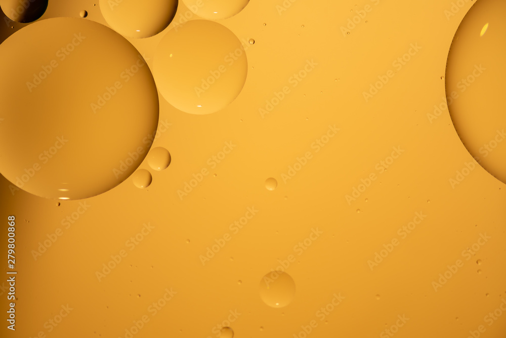 Wall mural golden yellow bubble oil droplet, abstract background