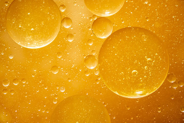golden yellow bubble oil droplet, abstract background
