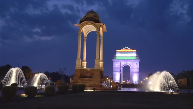 night shot of the historic canopy and fountains at india gate in new delhi, india